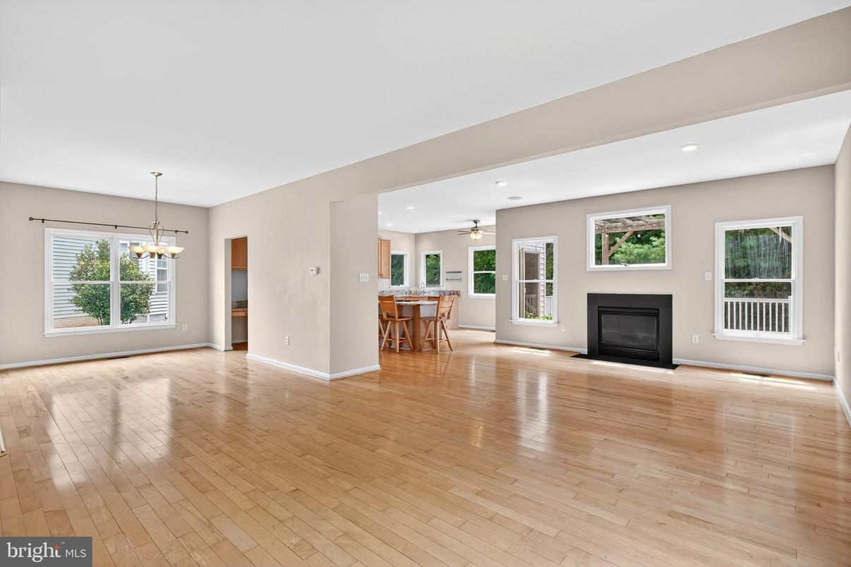 Dining room, Empty room, Fireplace, Interior, Pendant Lights, Recessed Lighting, Wood Texture Flooring