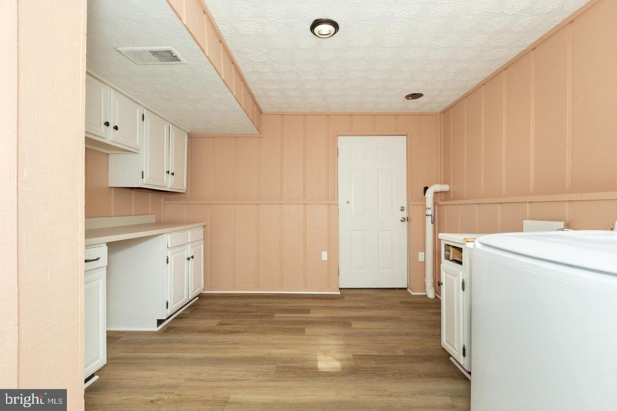 Interior, Recessed Lighting, Washer, Wood Texture Flooring, Wooden Walls