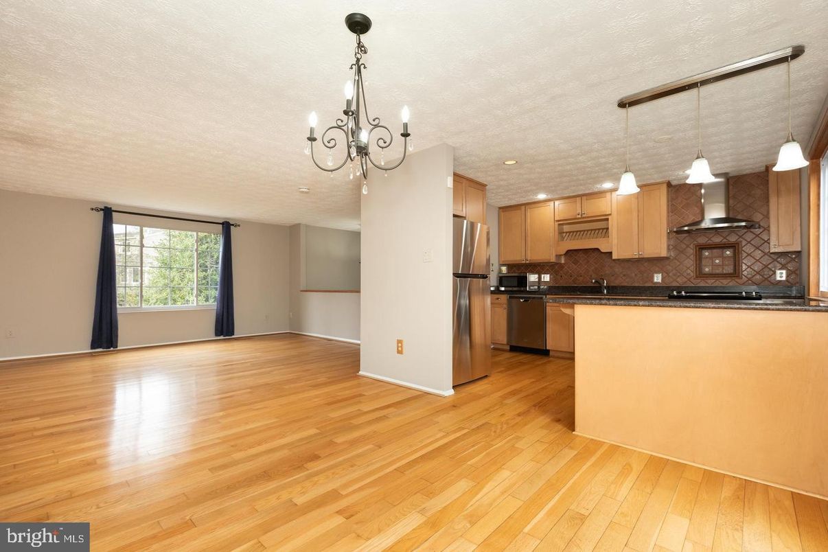 Chandelier, Interior, Kitchen, Pendant Lights, Recessed Lighting, Stainless Steel Appliances, Wood Texture Flooring