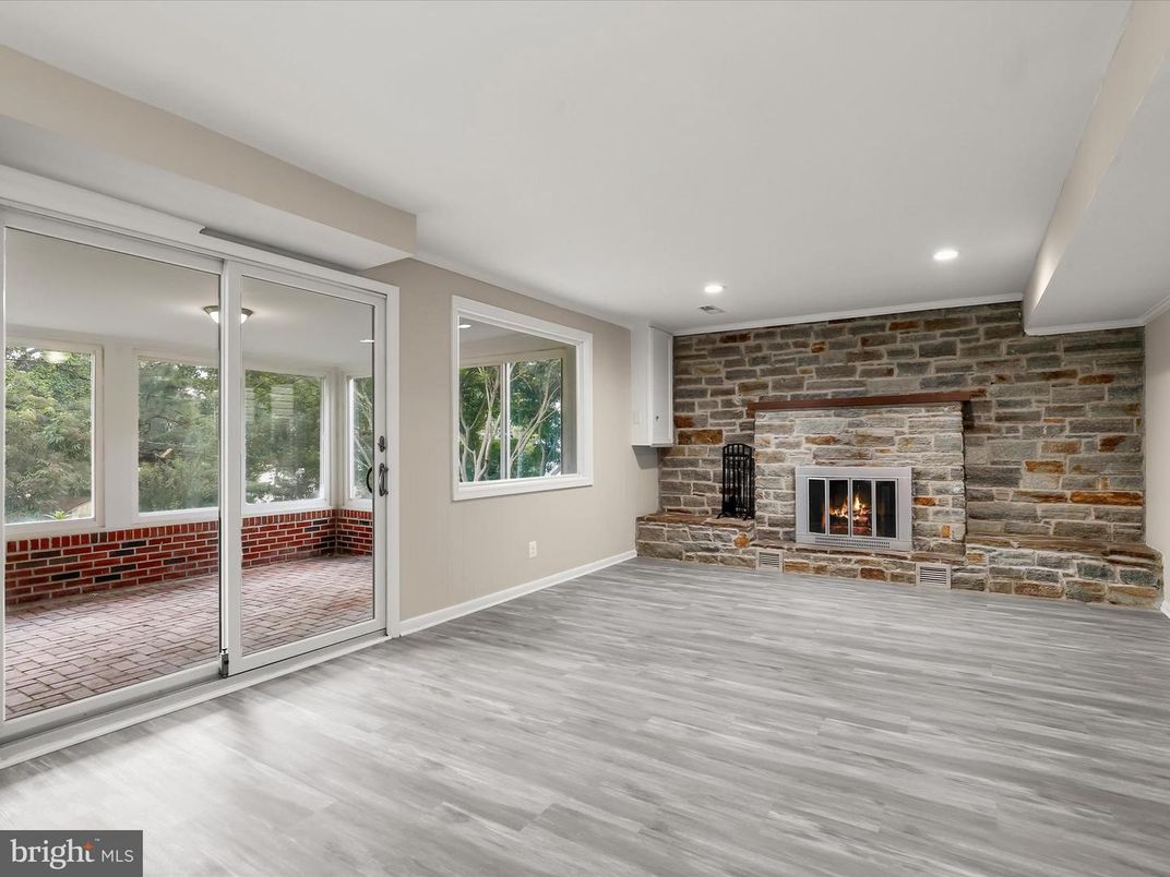 Empty room, Fireplace, Interior, Recessed Lighting, Stone Walls, Wood Texture Flooring