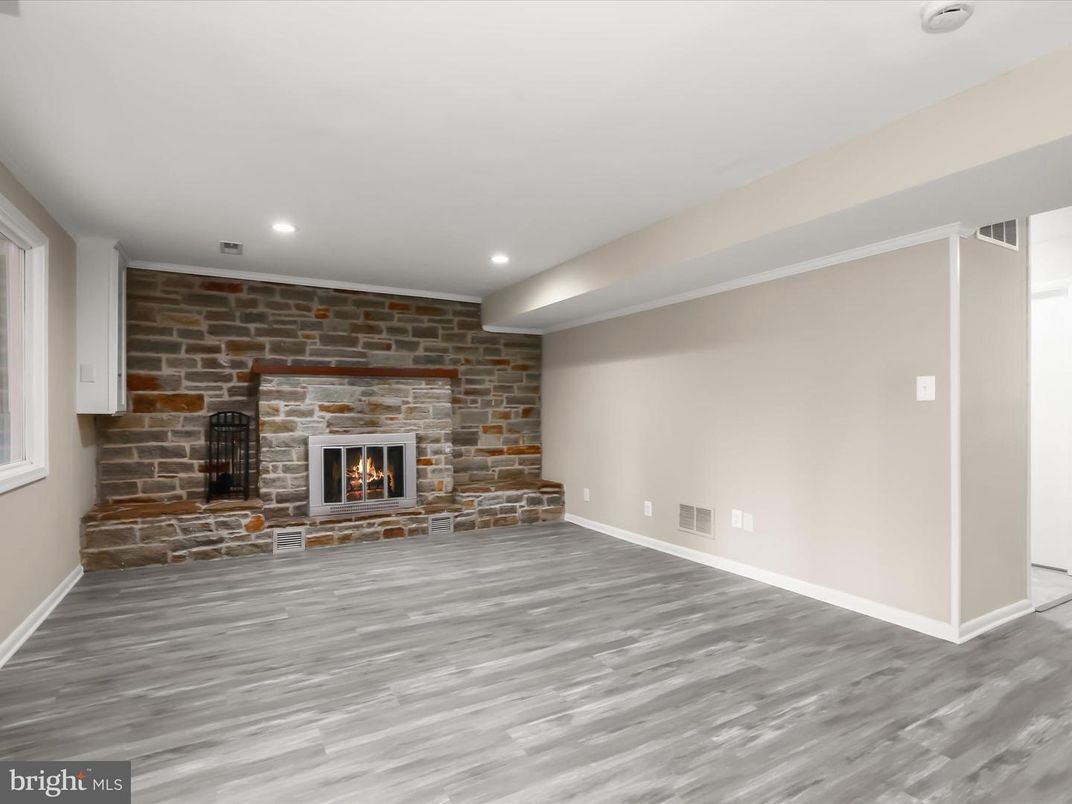 Empty room, Fireplace, Interior, Recessed Lighting, Stone Walls, Wood Texture Flooring