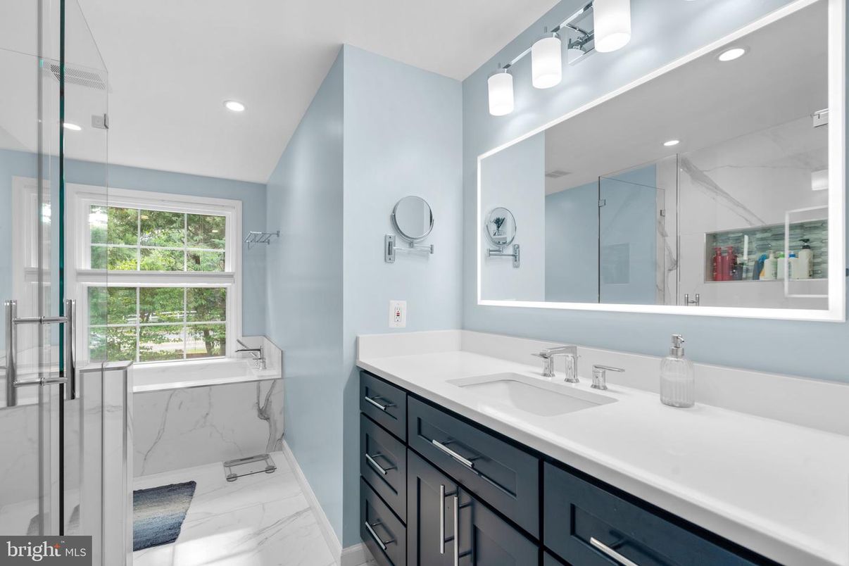 Bathroom, Dual Sink Vanities, Glass Shower, Interior, Marble, Marble Walls, Recessed Lighting