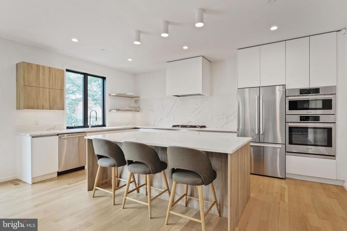 Interior, Kitchen, Marble Walls, Recessed Lighting, Stainless Steel Appliances, Wood Texture Flooring