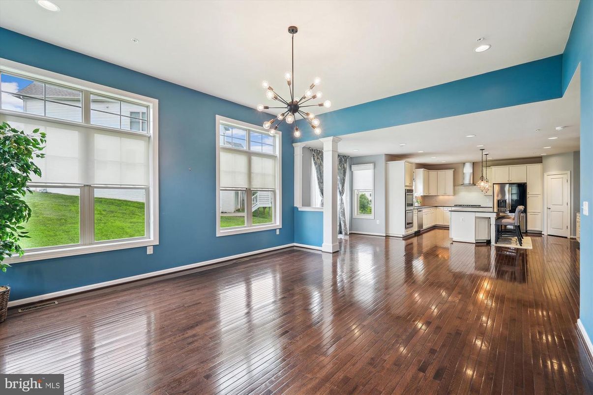 Empty room, Interior, Kitchen, Pendant Lights, Recessed Lighting, Stainless Steel Appliances, Wood Texture Flooring