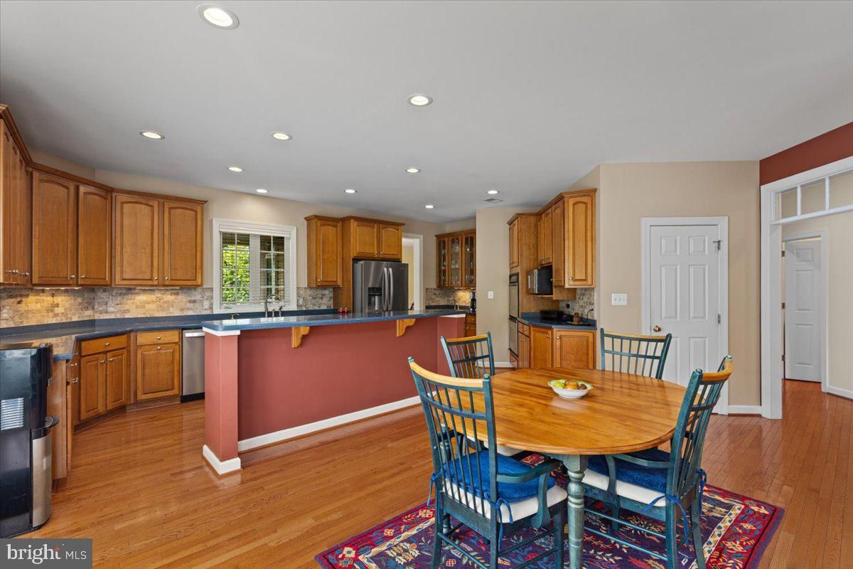 Dining room, Interior, Kitchen, Recessed Lighting, Stainless Steel Appliances, Wood Texture Flooring