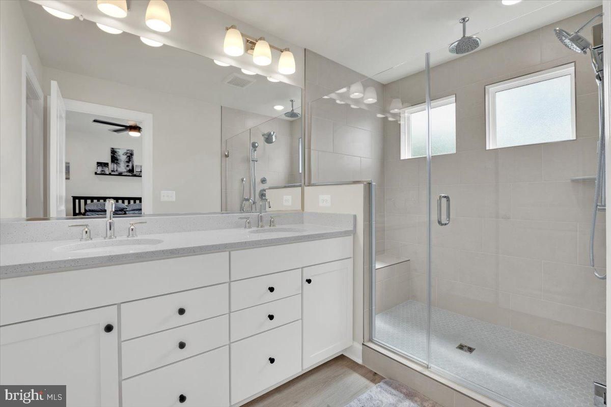 Bathroom, Dual Sink Vanities, Glass Shower, Interior, Wood Texture Flooring