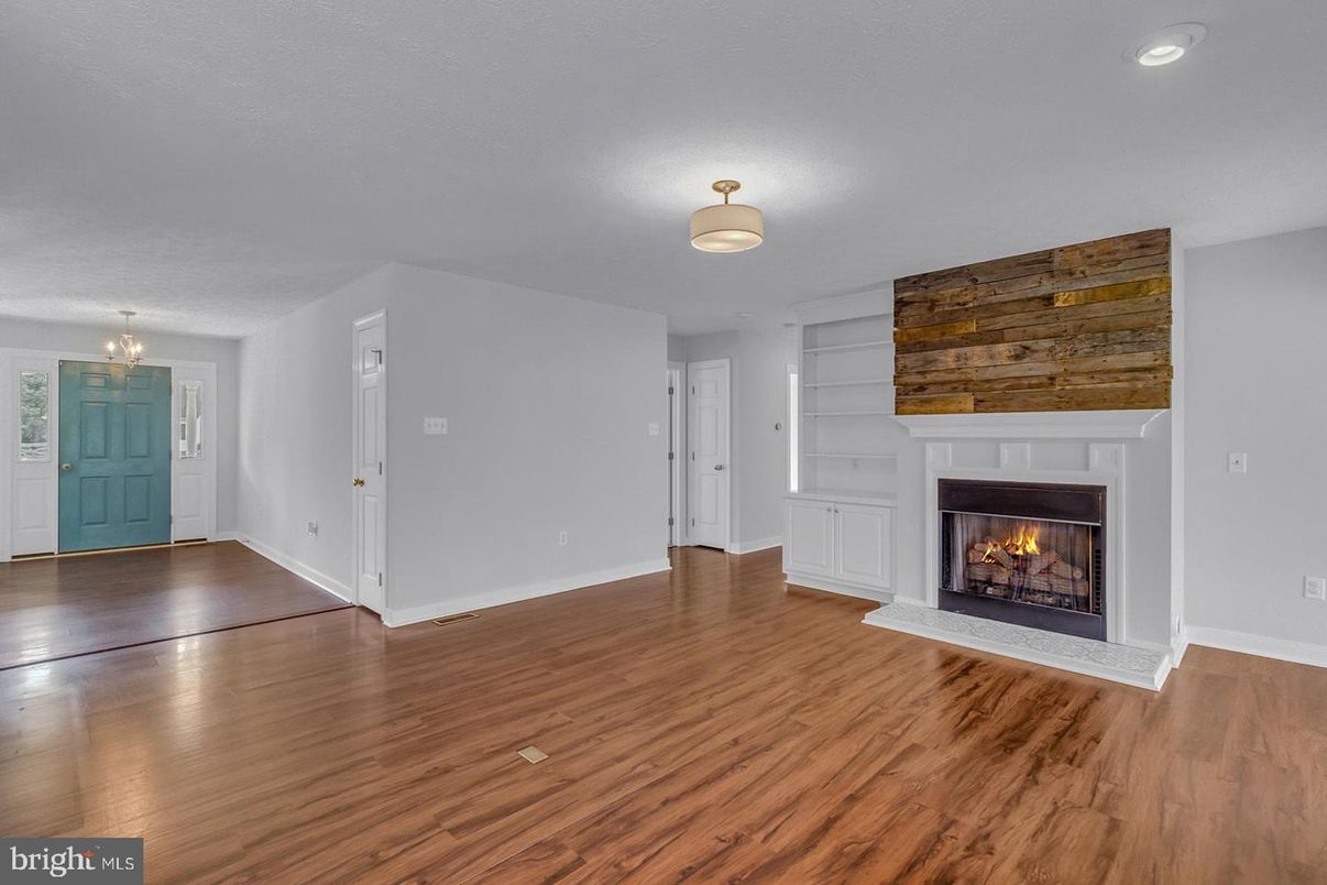 Empty room, Fireplace, Interior, Recessed Lighting, Wood Texture Flooring, Wooden Walls