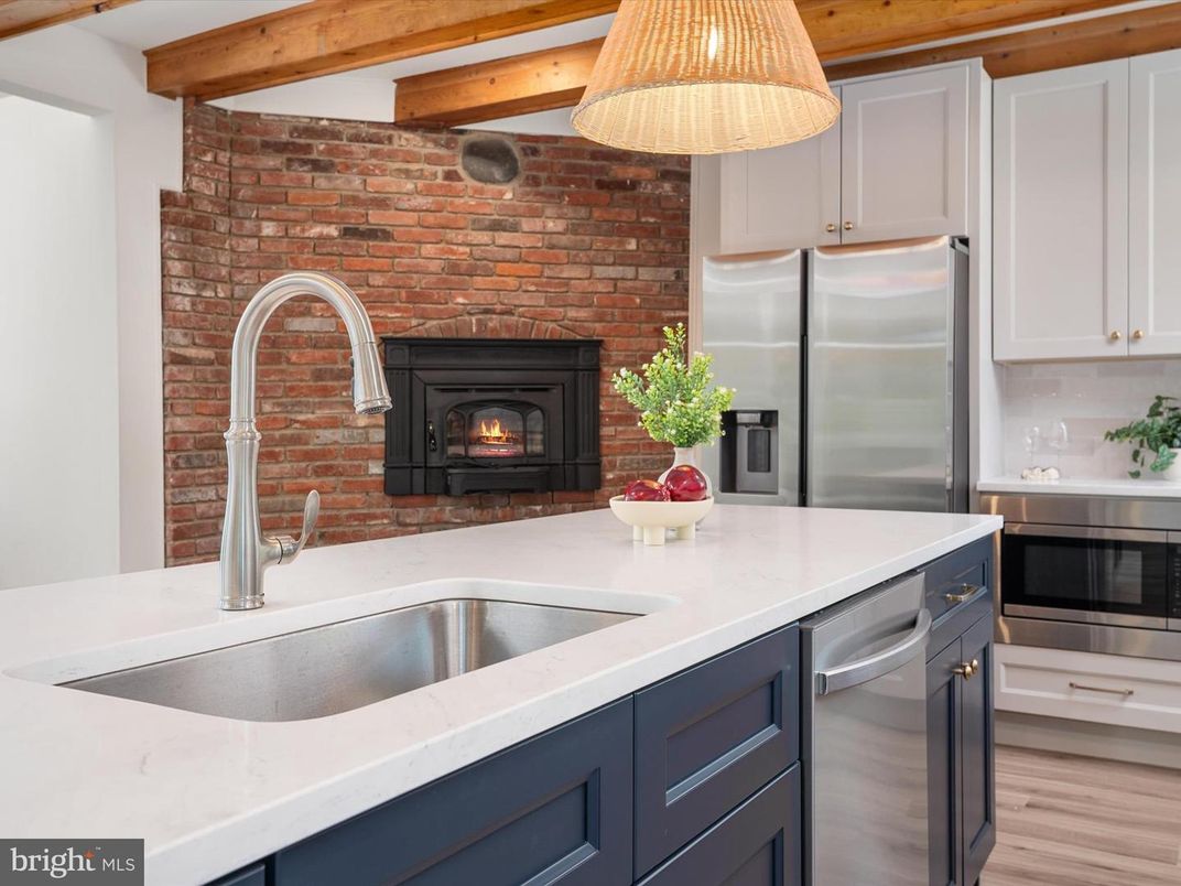 Fireplace, Interior, Kitchen, Pendant Lights, Stainless Steel Appliances, Stone Walls, Wooden Beams, Wood Texture Flooring