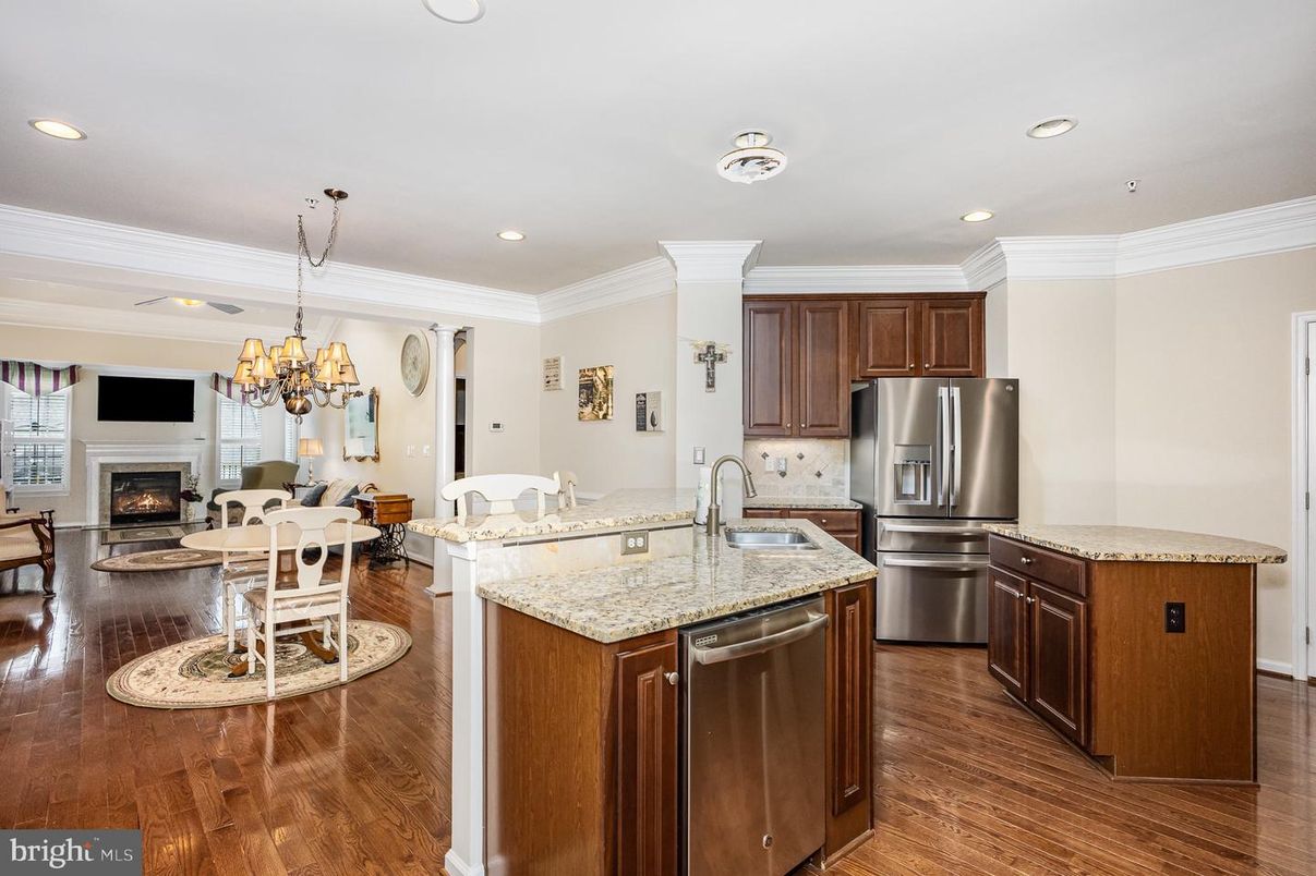Chandelier, Dining room, Fireplace, Interior, Kitchen, Living room, Recessed Lighting, Stainless Steel Appliances, Wood Texture Flooring