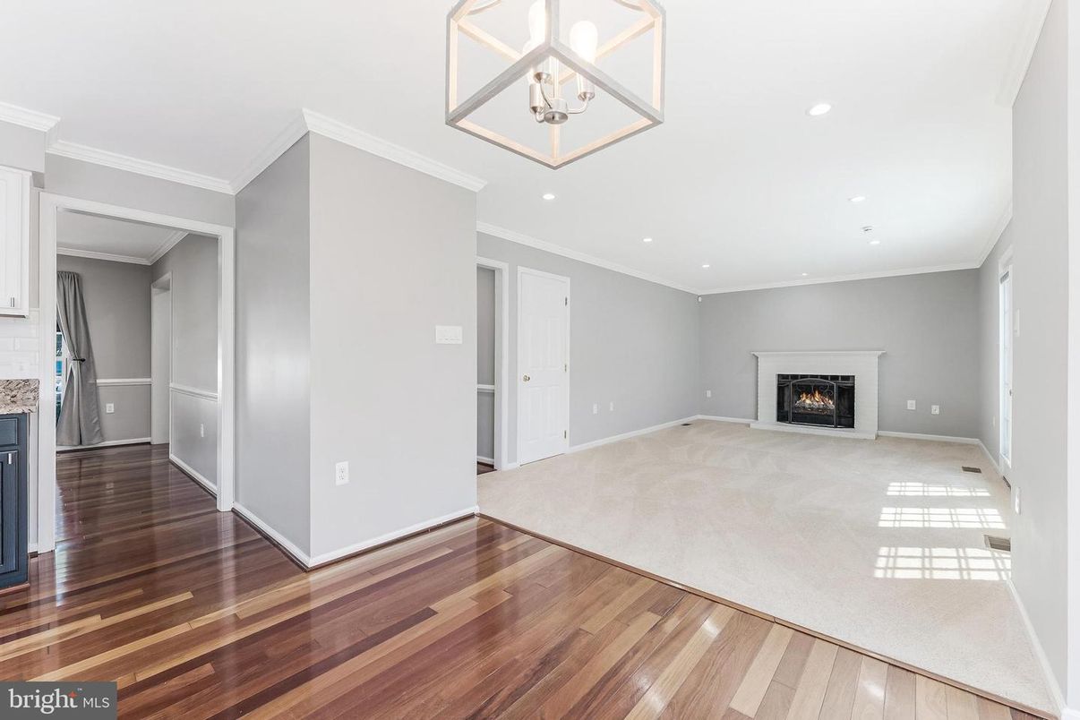Empty room, Fireplace, Interior, Pendant Lights, Recessed Lighting, Wood Texture Flooring