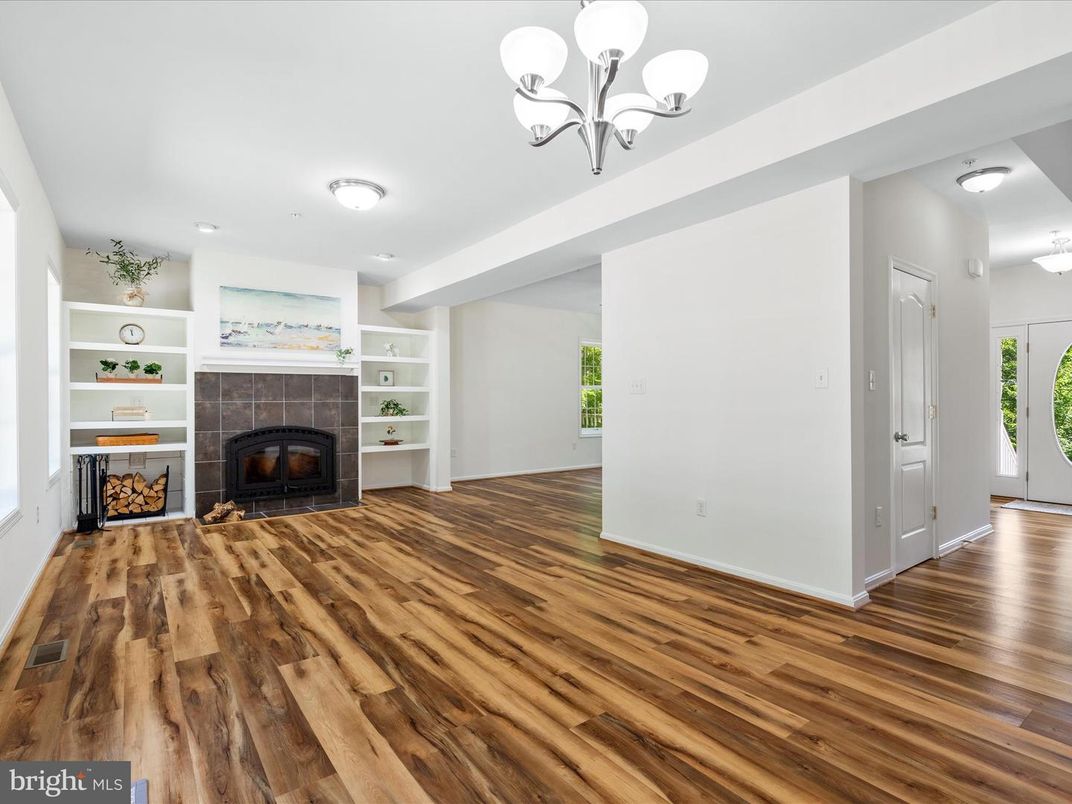Chandelier, Empty room, Fireplace, Interior, Recessed Lighting, Wood Texture Flooring