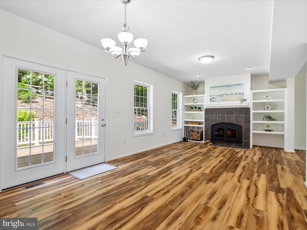 Chandelier, Empty room, Fireplace, Interior, Recessed Lighting, Wood Texture Flooring