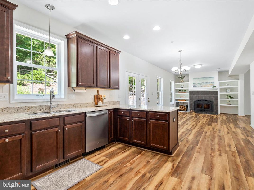 Chandelier, Fireplace, Interior, Kitchen, Pendant Lights, Recessed Lighting, Wood Texture Flooring