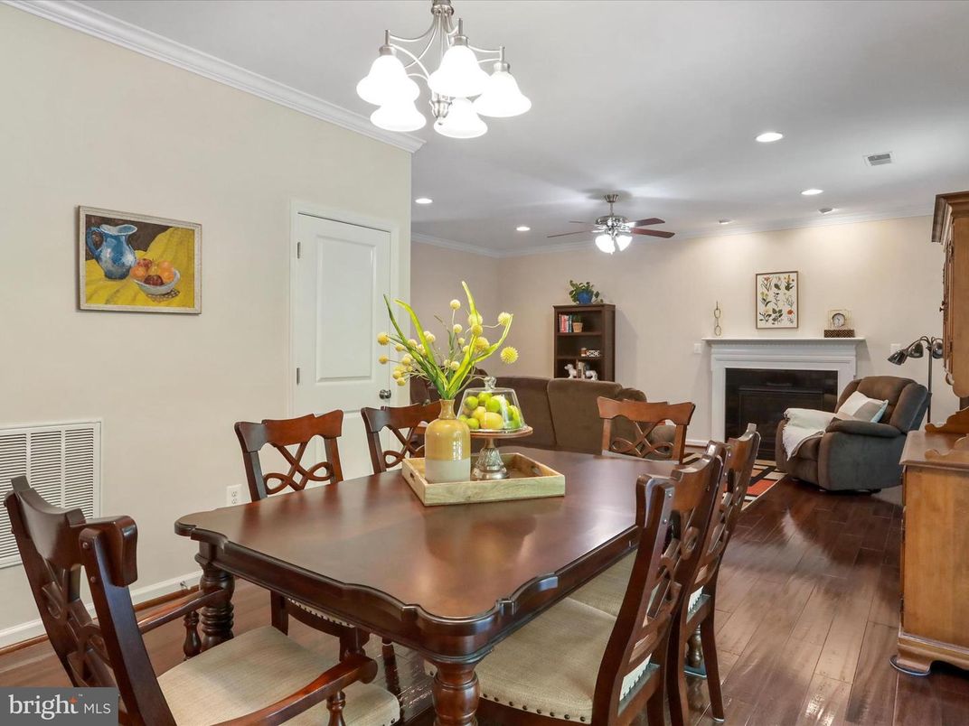 Dining room, Fireplace, Interior, Living room, Recessed Lighting, Wood Texture Flooring