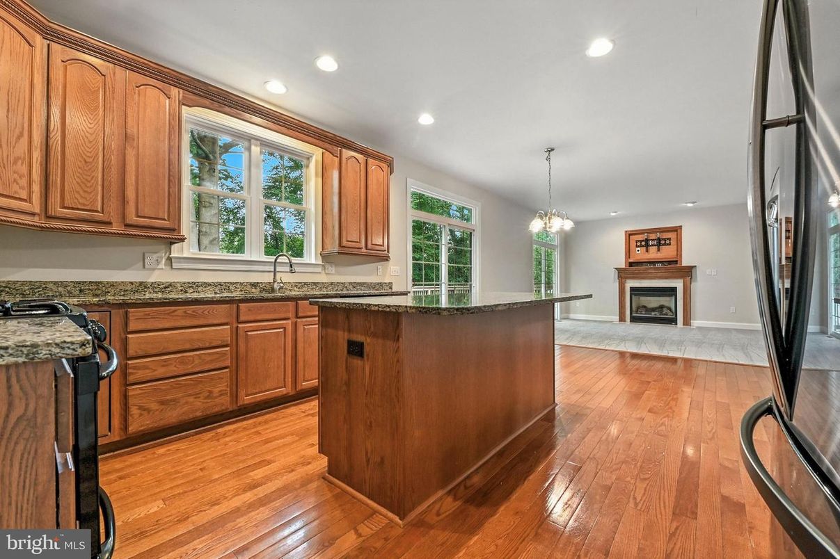 Chandelier, Fireplace, Interior, Kitchen, Pendant Lights, Recessed Lighting, Wood Texture Flooring