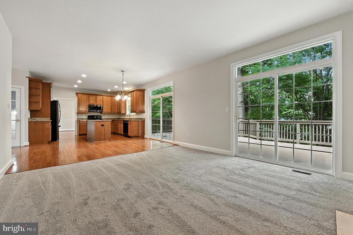 Empty room, Interior, Kitchen, Pendant Lights, Recessed Lighting, Stainless Steel Appliances, Wood Texture Flooring