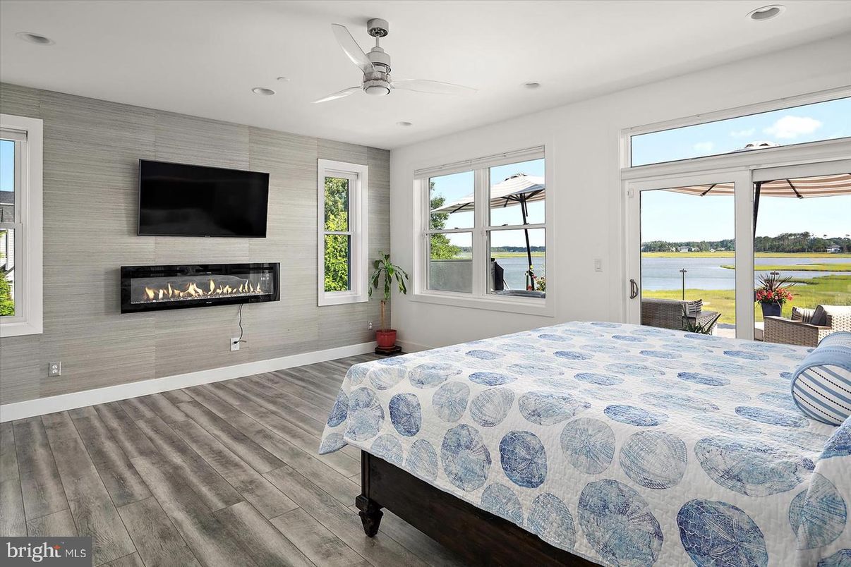 Bedroom, Fireplace, Interior, Recessed Lighting, Water, Wood Texture Flooring