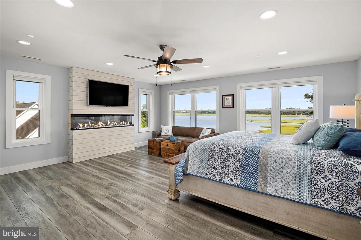 Bedroom, Fireplace, Interior, Recessed Lighting, Water, Wood Texture Flooring