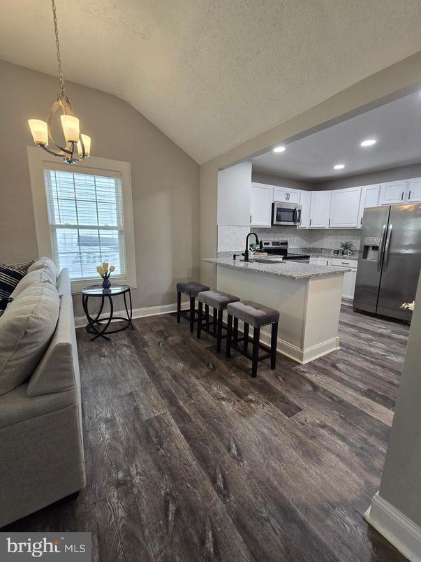 Dining room, Interior, Kitchen, Pendant Lights, Recessed Lighting, Stainless Steel Appliances, Wood Texture Flooring