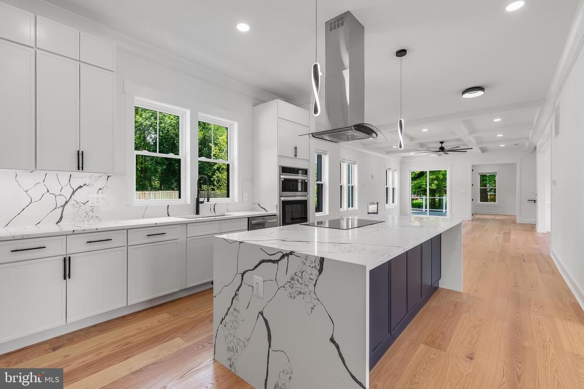 Interior, Kitchen, Marble Walls, Pendant Lights, Recessed Lighting, Stainless Steel Appliances, Wood Texture Flooring
