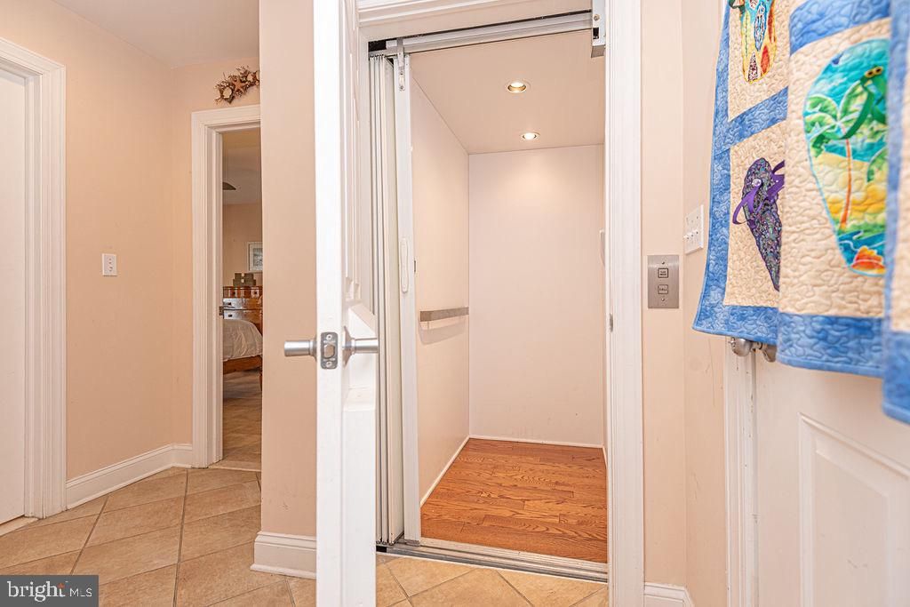 Elevator, Interior, Recessed Lighting, Wood Texture Flooring