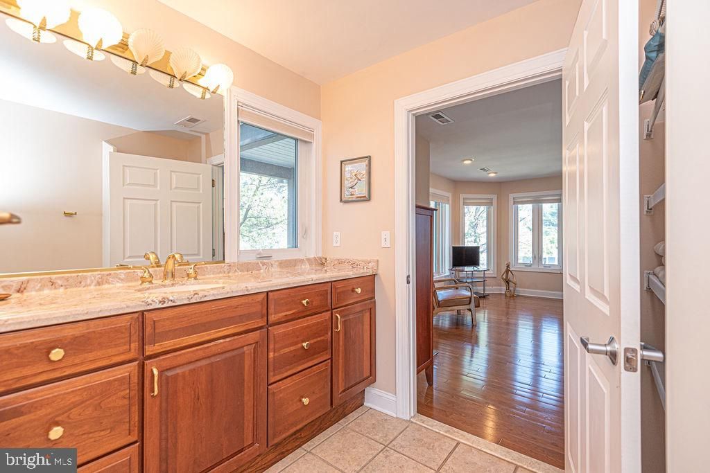 Bathroom, Dual Sink Vanities, Interior, Recessed Lighting, Wood Texture Flooring