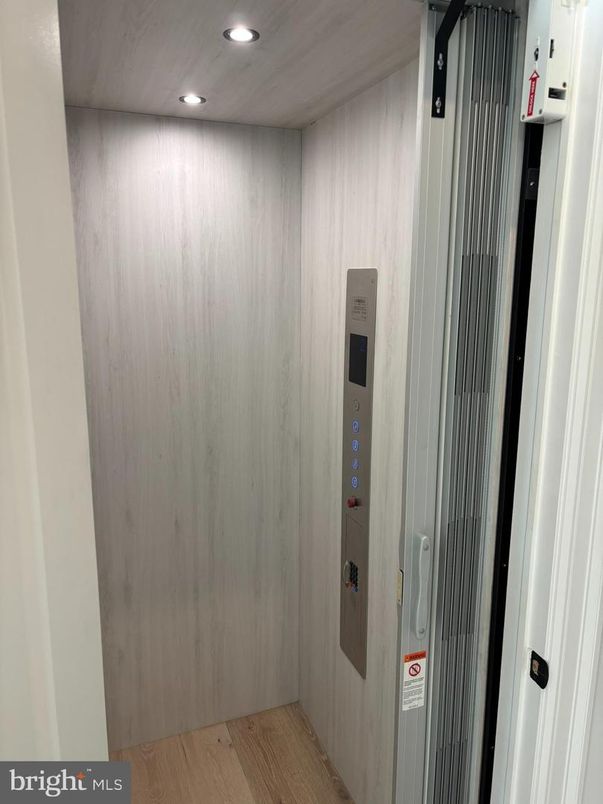Elevator, Interior, Recessed Lighting, Wood Texture Flooring, Wooden Walls