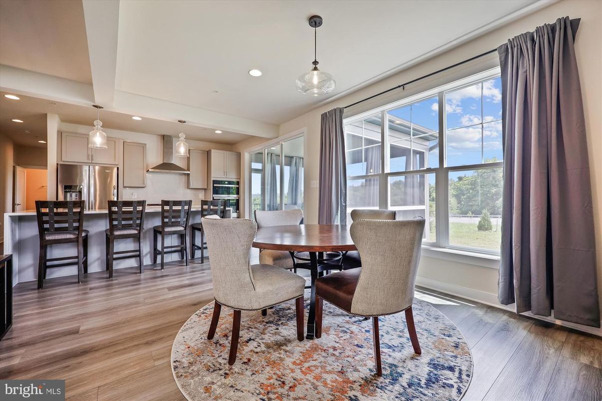 Dining room, Interior, Kitchen, Pendant Lights, Recessed Lighting, Stainless Steel Appliances, Wood Texture Flooring