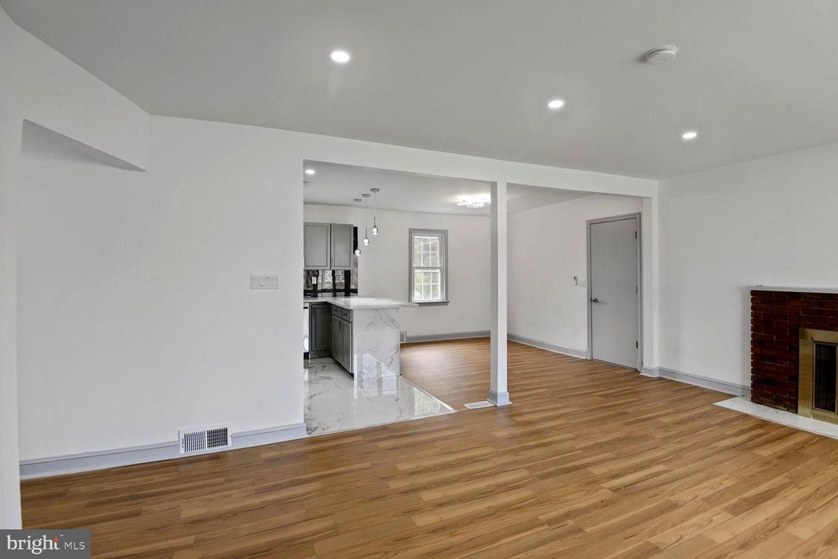 Empty room, Fireplace, Interior, Kitchen, Marble, Recessed Lighting, Wood Texture Flooring