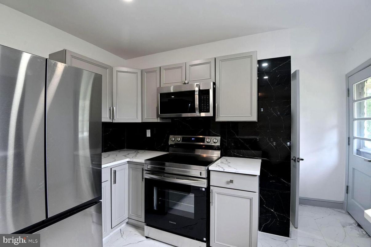 Interior, Kitchen, Marble, Marble Walls, Recessed Lighting, Stainless Steel Appliances
