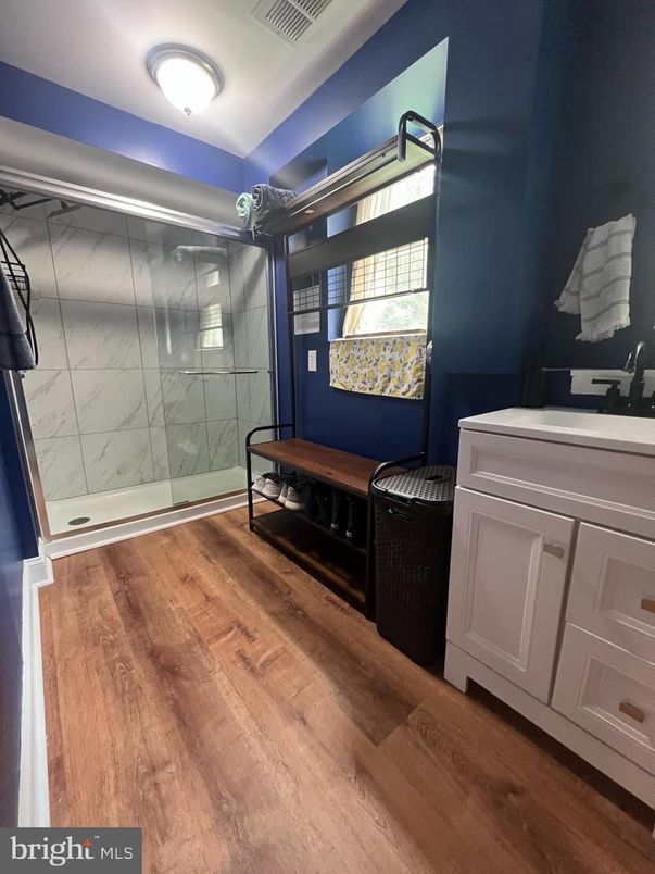 Bathroom, Glass Shower, Interior, Marble Walls, Wood Texture Flooring