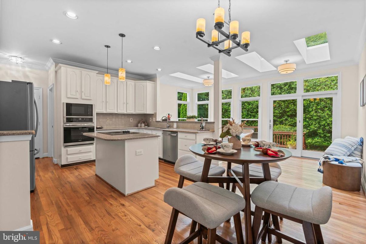 Chandelier, Dining room, Interior, Kitchen, Pendant Lights, Recessed Lighting, Stainless Steel Appliances, Wood Texture Flooring