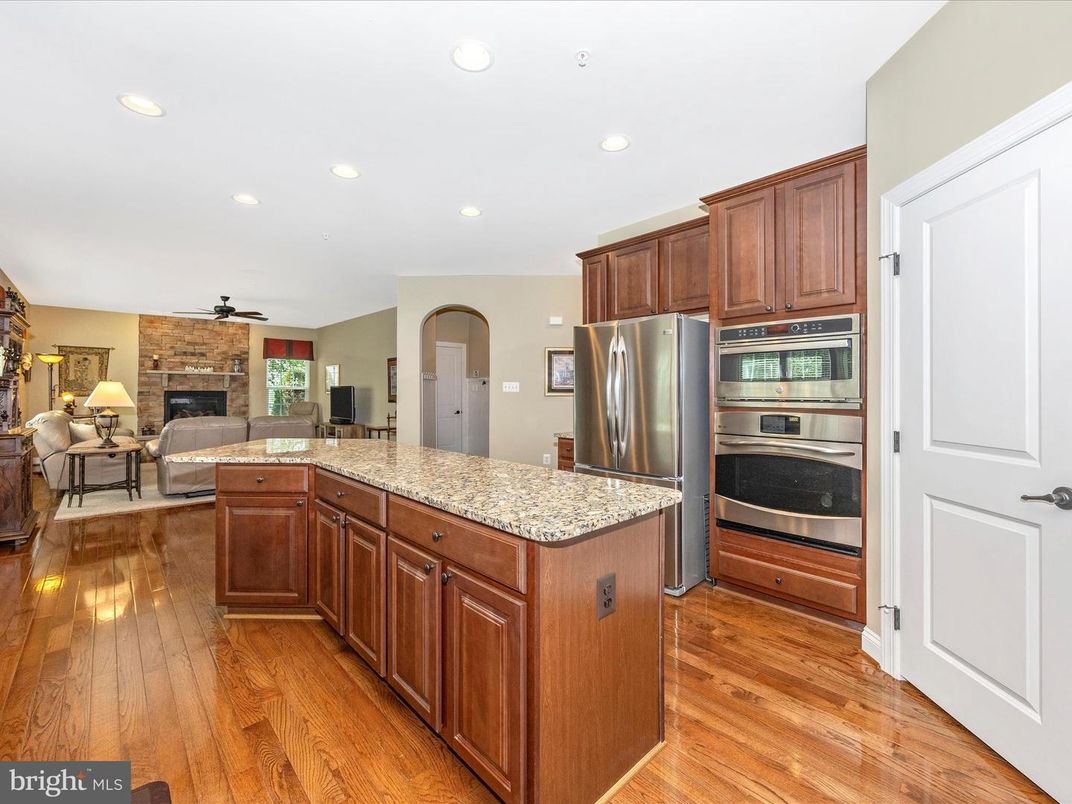 Fireplace, Interior, Kitchen, Living room, Recessed Lighting, Stainless Steel Appliances, Wood Texture Flooring