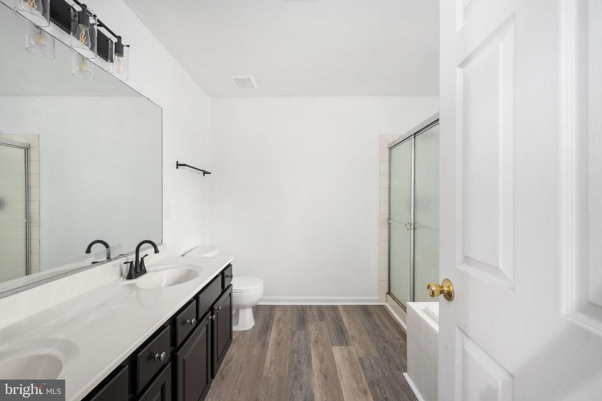Bathroom, Dual Sink Vanities, Glass Shower, Interior, Wood Texture Flooring