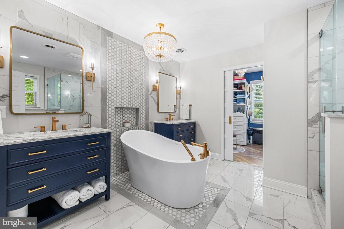 Bathroom, Chandelier, Dual Sink Vanities, Free Standing Baths, Glass Shower, Interior, Marble, Marble Walls, Recessed Lighting, Wood Texture Flooring