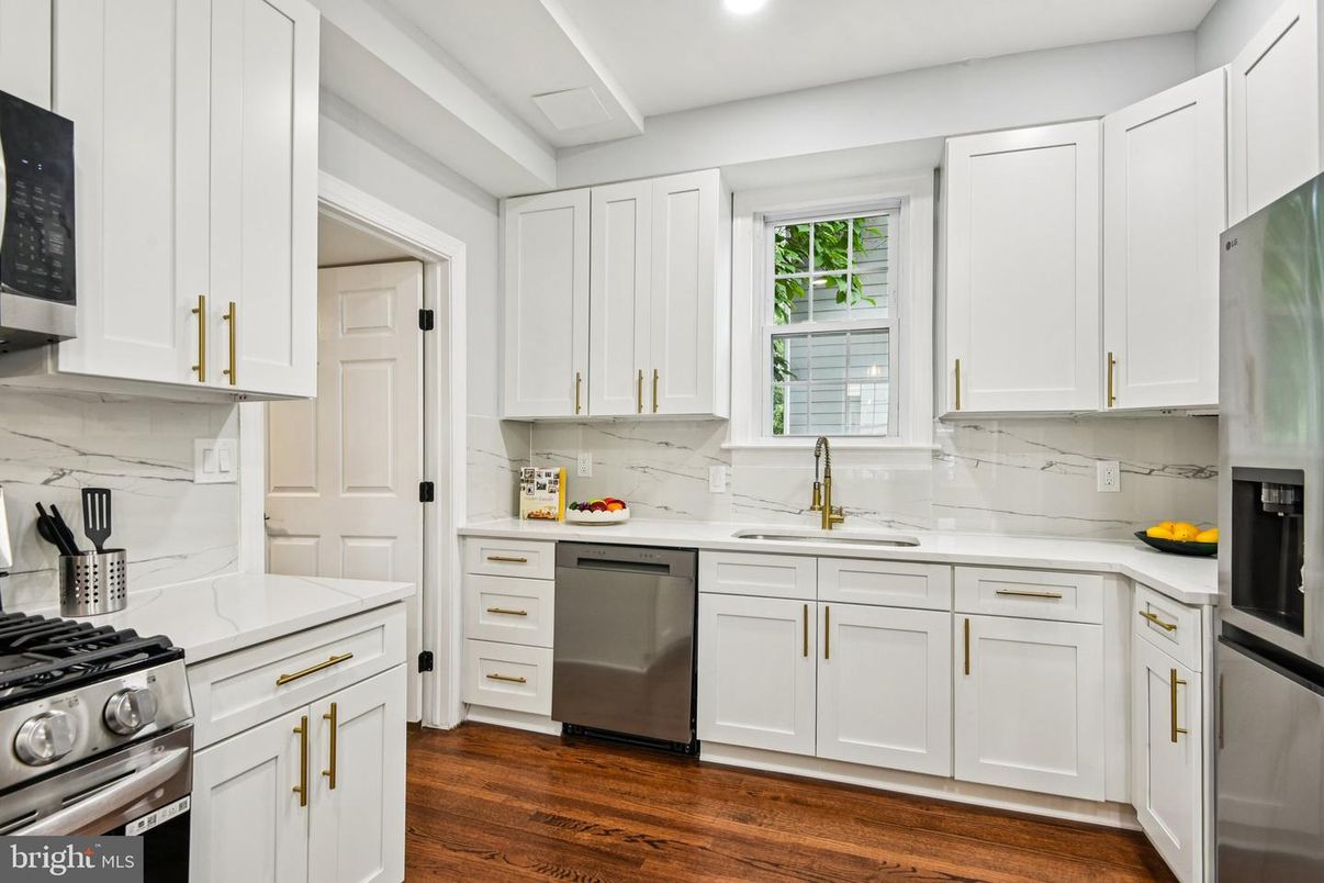 Interior, Kitchen, Marble Walls, Recessed Lighting, Stainless Steel Appliances, Wood Texture Flooring