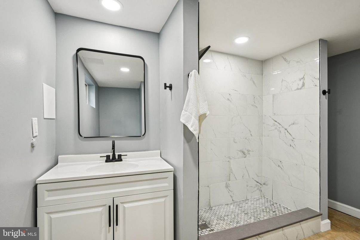 Bathroom, Glass Shower, Interior, Marble Walls, Recessed Lighting, Wood Texture Flooring