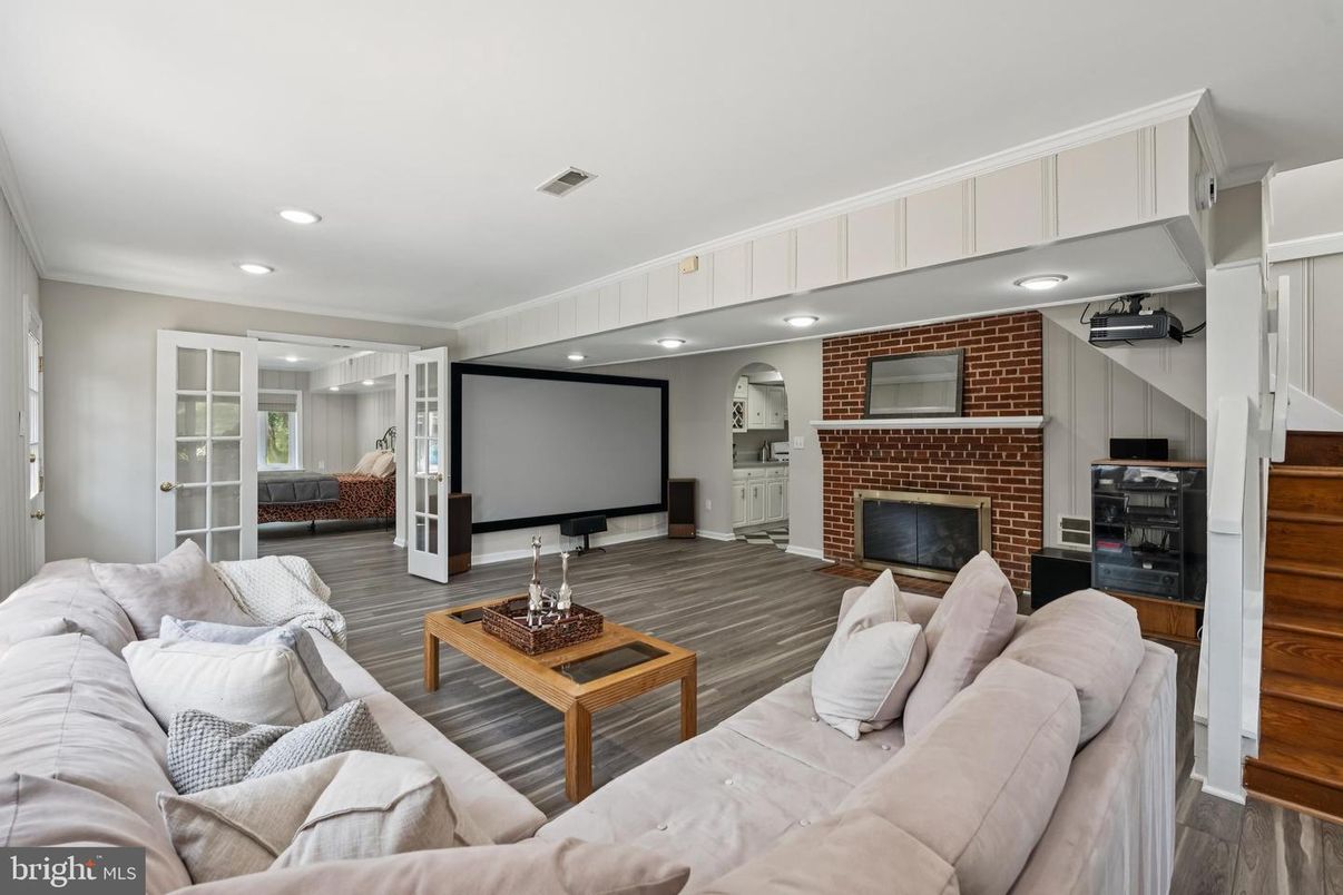 Fireplace, Interior, Living room, Projection Screen, Recessed Lighting, Stone Walls, Wood Texture Flooring