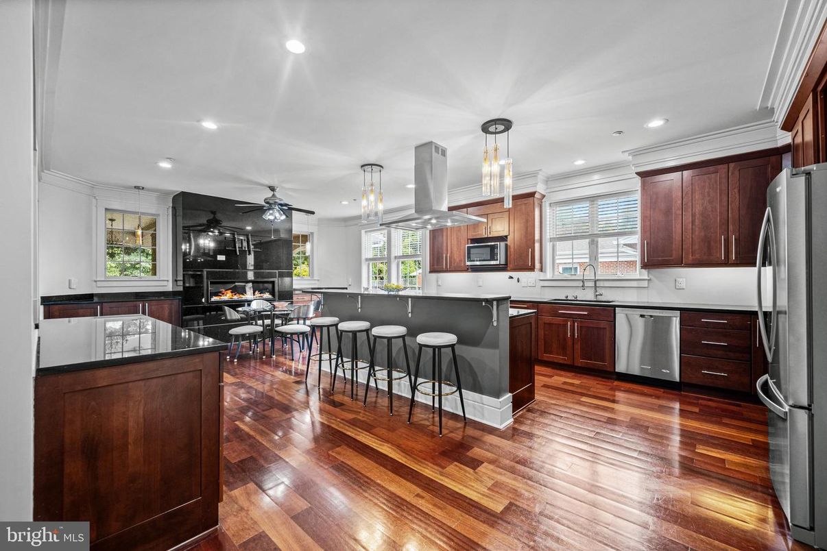 Dining room, Interior, Kitchen, Pendant Lights, Recessed Lighting, Stainless Steel Appliances, Wood Texture Flooring