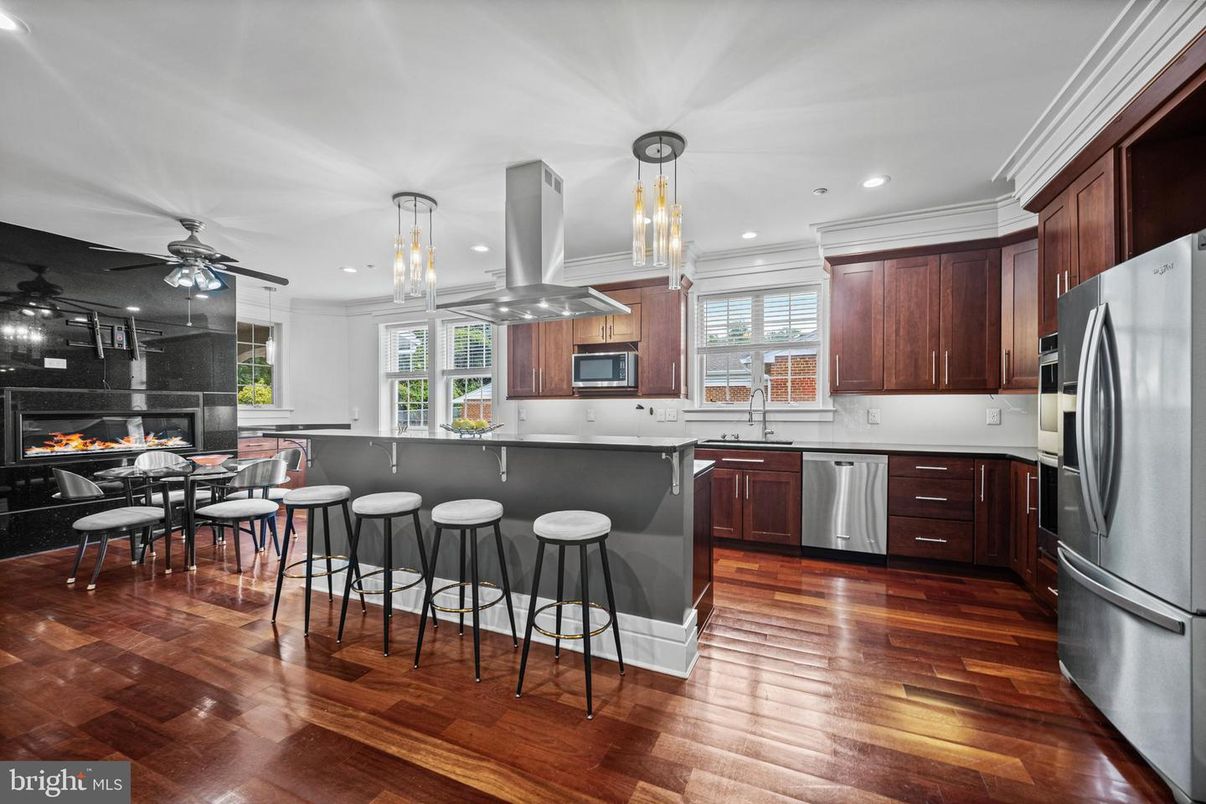 Dining room, Fireplace, Interior, Kitchen, Pendant Lights, Recessed Lighting, Stainless Steel Appliances, Wood Texture Flooring
