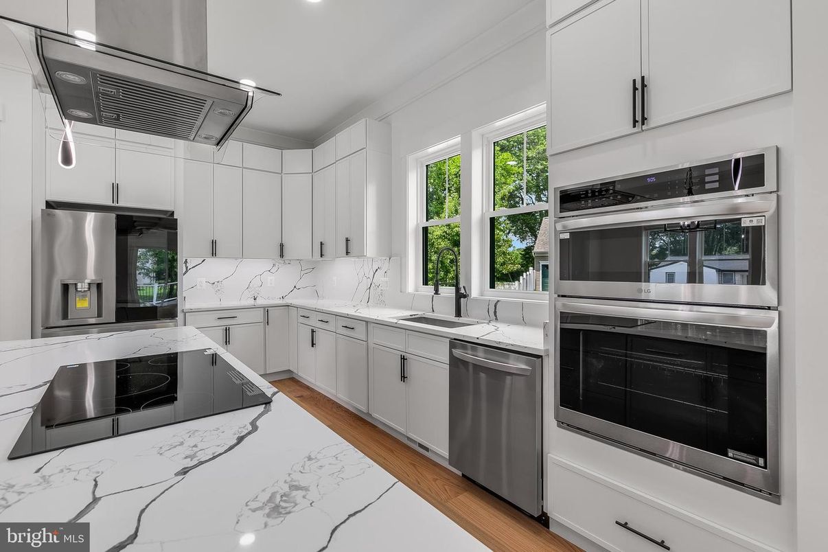 Interior, Kitchen, Marble Walls, Recessed Lighting, Stainless Steel Appliances, Wood Texture Flooring