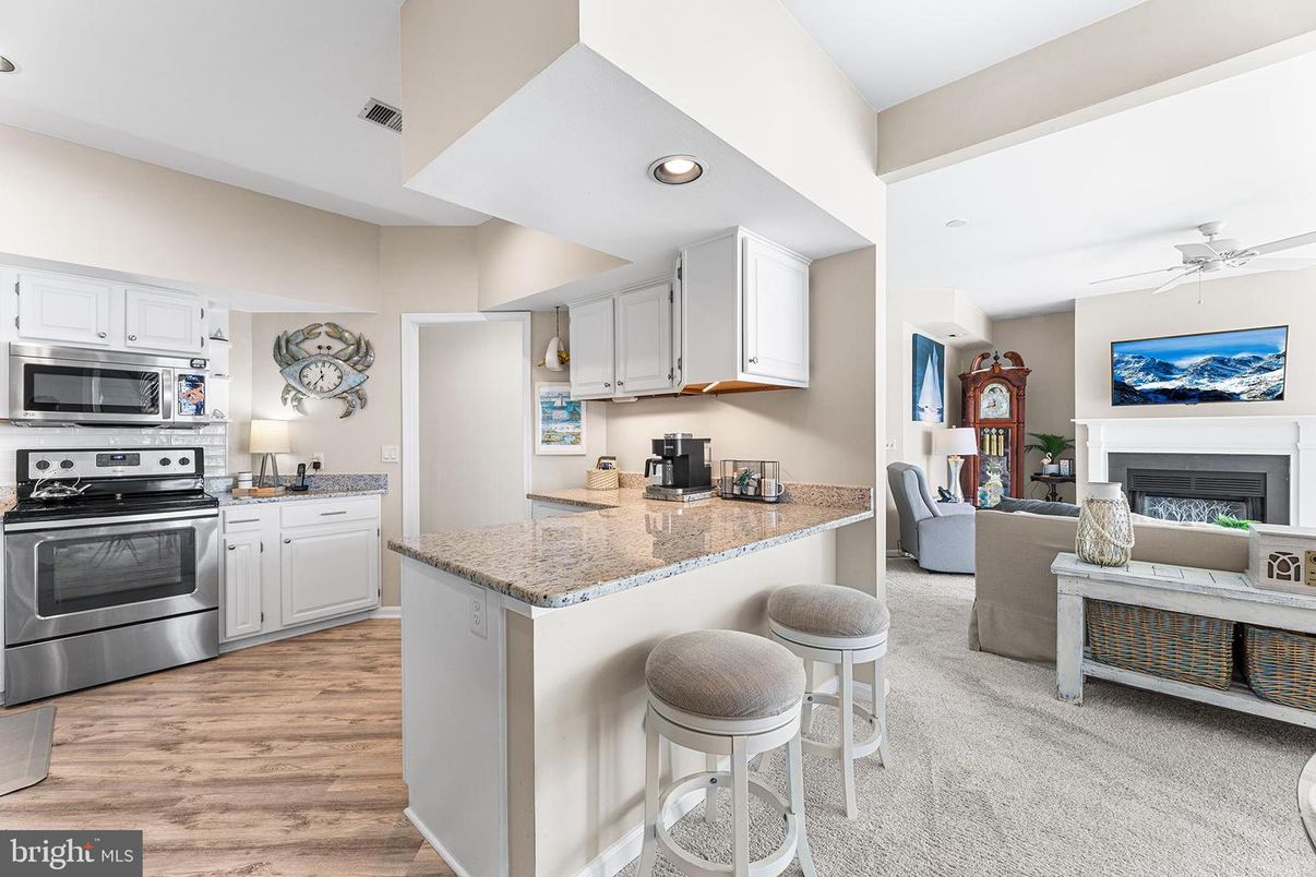 Fireplace, Interior, Kitchen, Living room, Recessed Lighting, Stainless Steel Appliances, Wood Texture Flooring