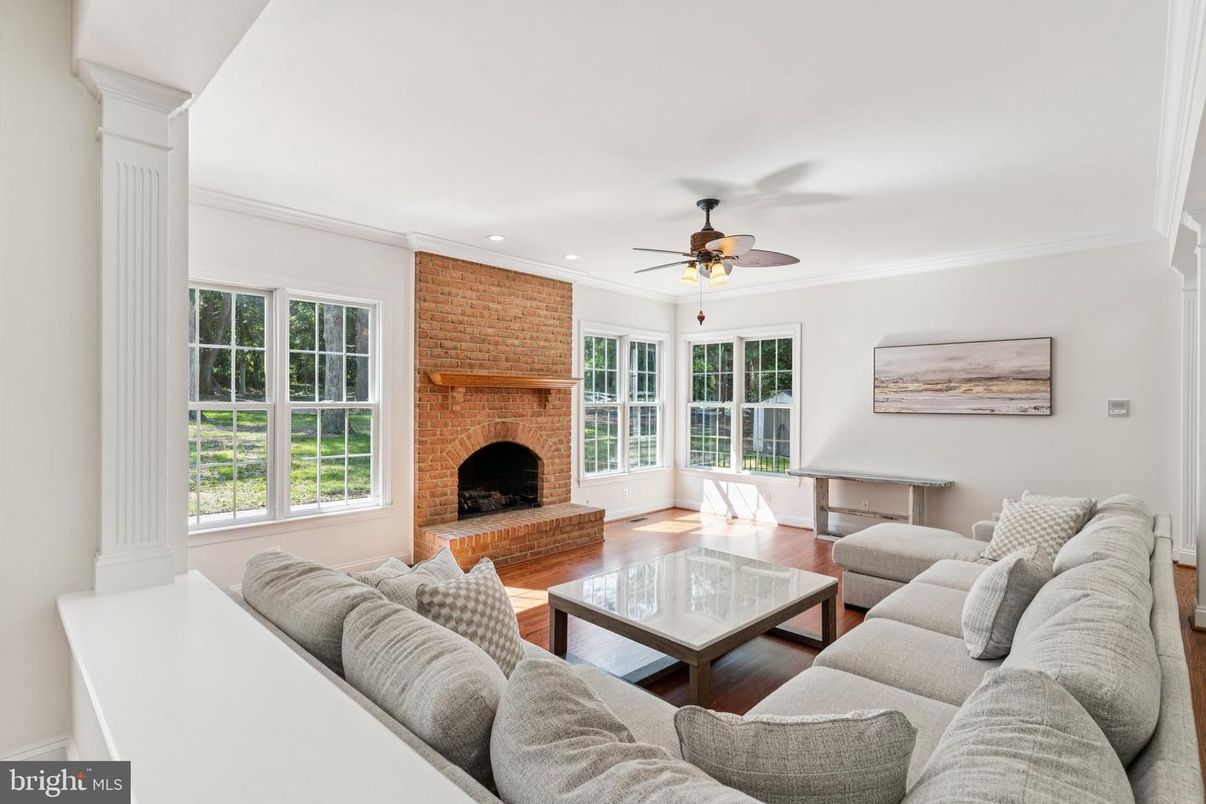 Fireplace, Interior, Living room, Recessed Lighting, Stone Walls, Wood Texture Flooring