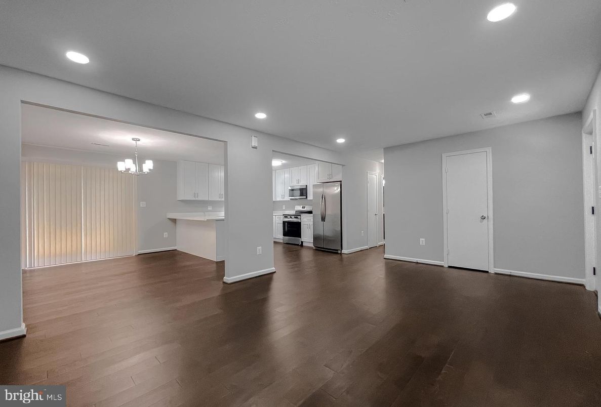 Chandelier, Empty room, Interior, Kitchen, Recessed Lighting, Stainless Steel Appliances, Wood Texture Flooring