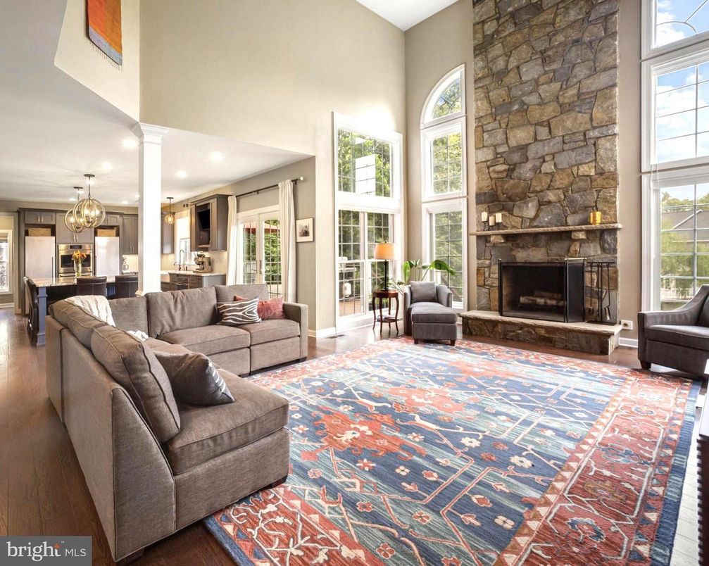 Chandelier, Fireplace, Interior, Kitchen, Living room, Recessed Lighting, Stone Walls, Wood Texture Flooring
