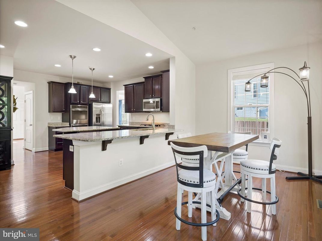 Dining room, Interior, Kitchen, Pendant Lights, Recessed Lighting, Stainless Steel Appliances, Wood Texture Flooring