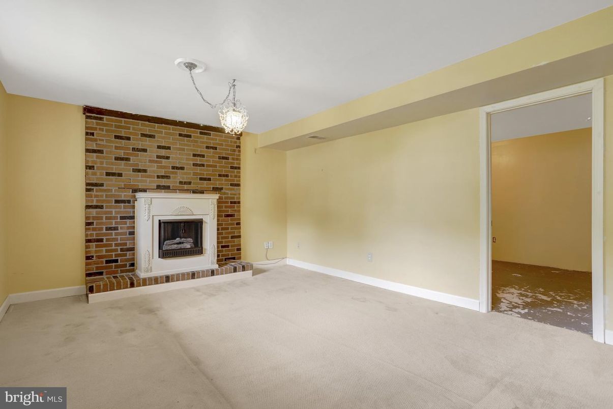 Chandelier, Empty room, Fireplace, Interior, Pendant Lights, Stone Walls