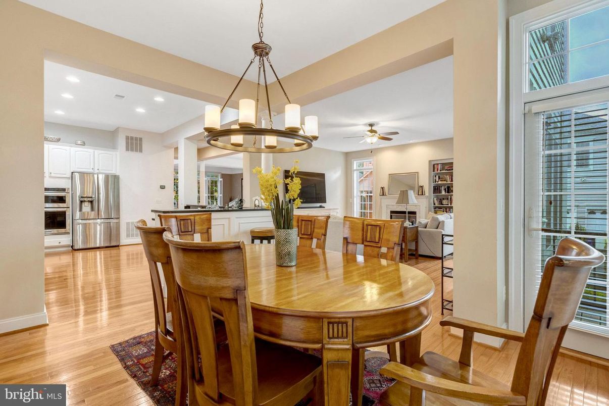 Chandelier, Dining room, Fireplace, Interior, Kitchen, Recessed Lighting, Stainless Steel Appliances, Wood Texture Flooring