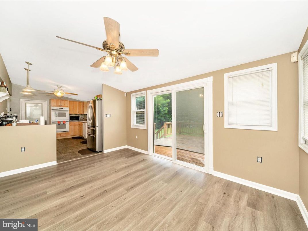 Empty room, Interior, Kitchen, Pendant Lights, Stainless Steel Appliances, Wood Texture Flooring