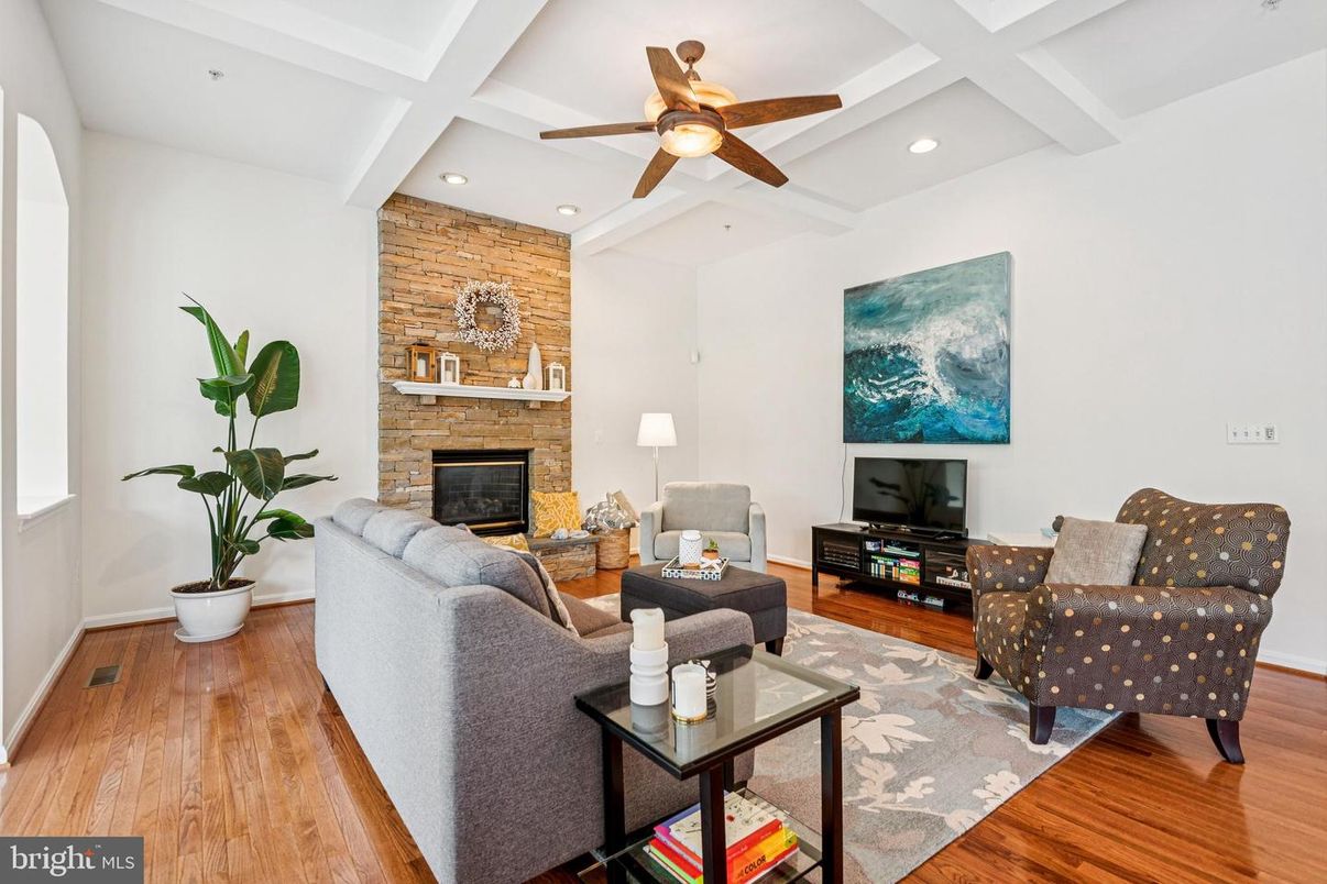 Fireplace, Interior, Living room, Recessed Lighting, Stone Walls, Wood Texture Flooring